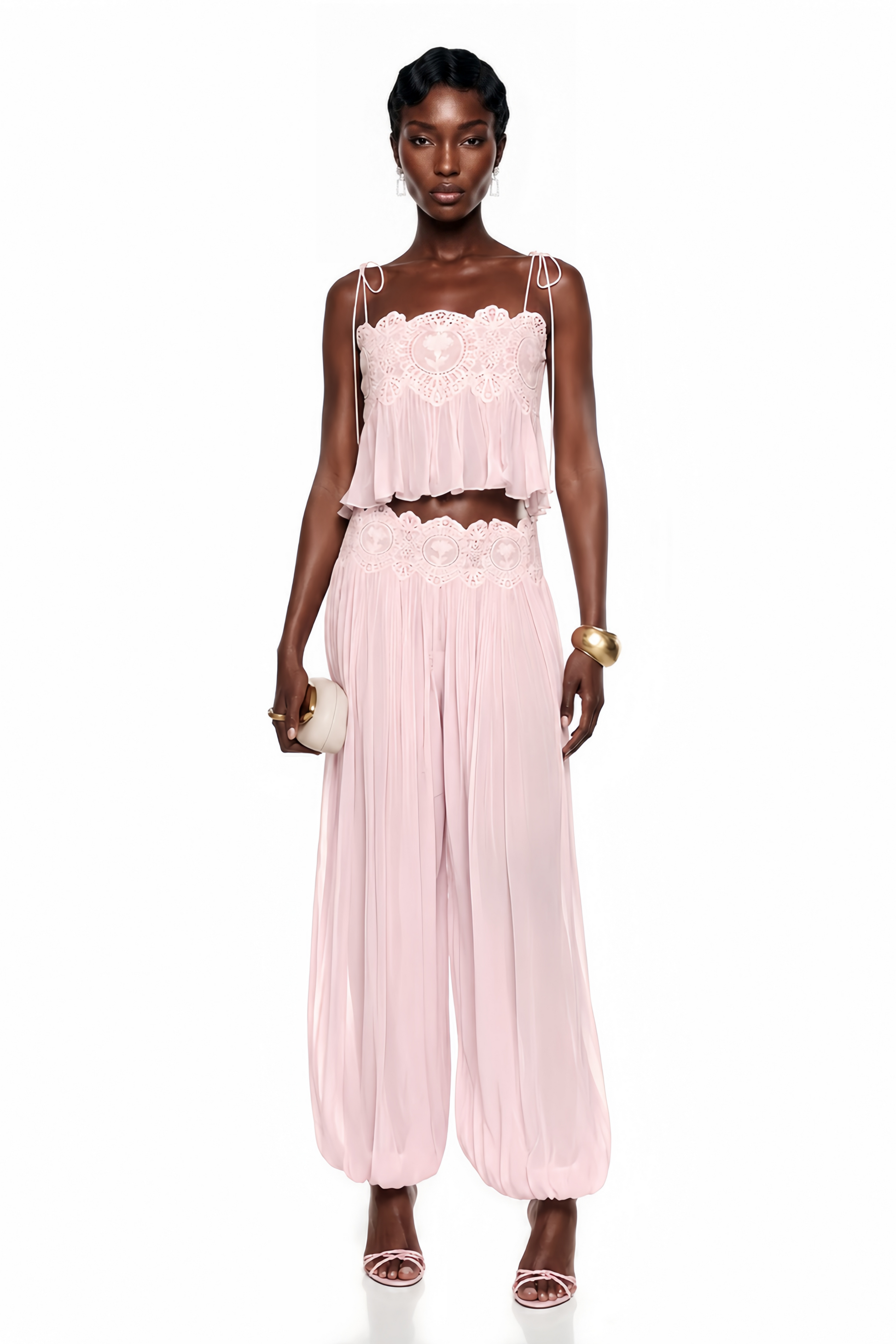 Light pink pleated two-piece set featuring a lace-trimmed camisole crop top and matching wide-leg harem pants